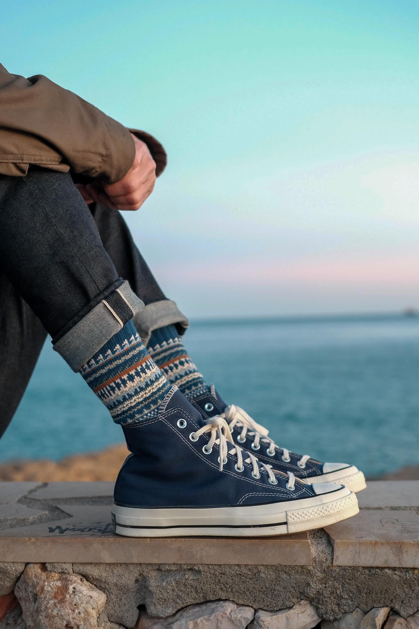 Kuki Sock styled with blue Converse sneakers