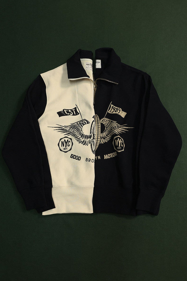 Heavyweight motorcycle half-zip sweatshirt featuring a vintage winged wheel graphic. 460g cotton fabric with a bold black and cream design.