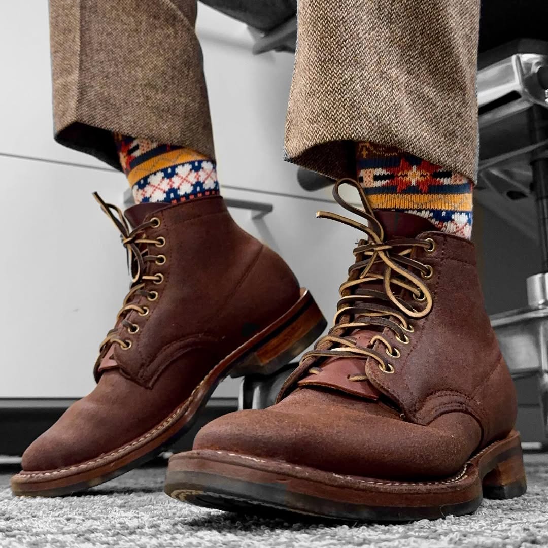 tribal pattern socks styled with brown leather boots casual outfit detail