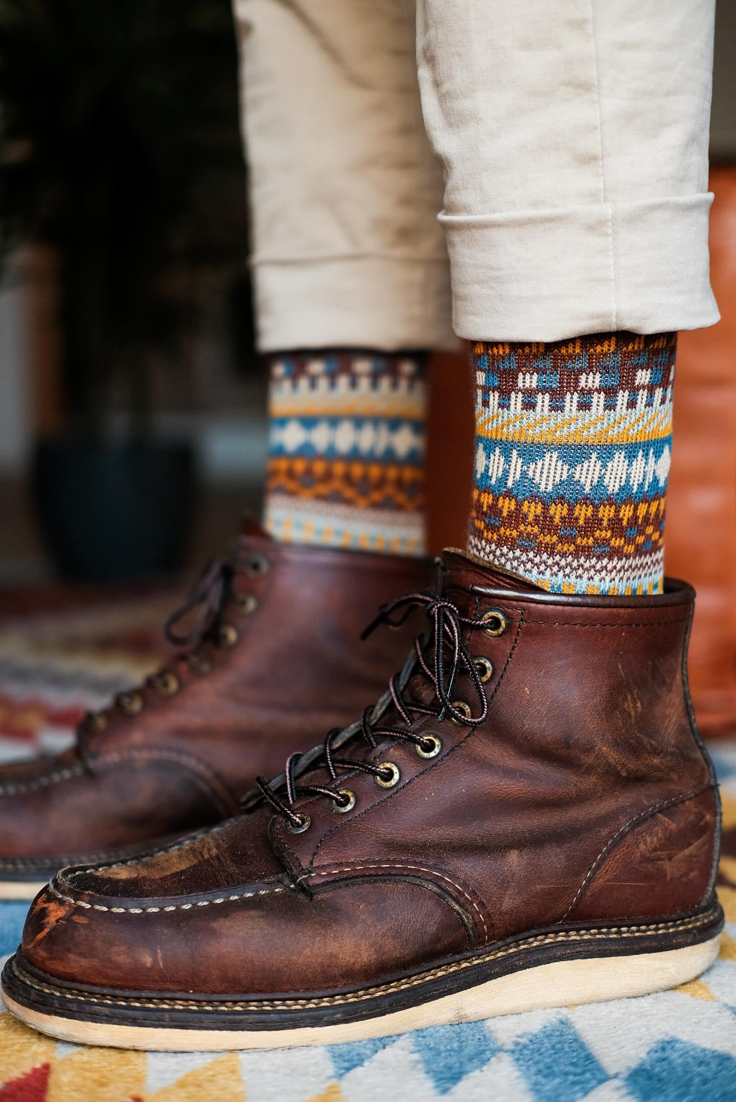 Kizune Brown patterned crew socks with an intricate multi-color artisan weave on a dark chocolate base.
