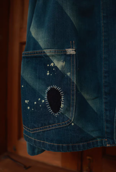 close up of distressed denim jacket comfysocks