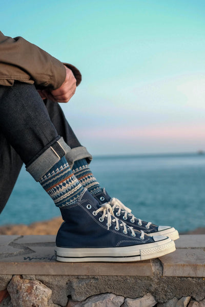 Kuki Sock styled with blue Converse sneakers

