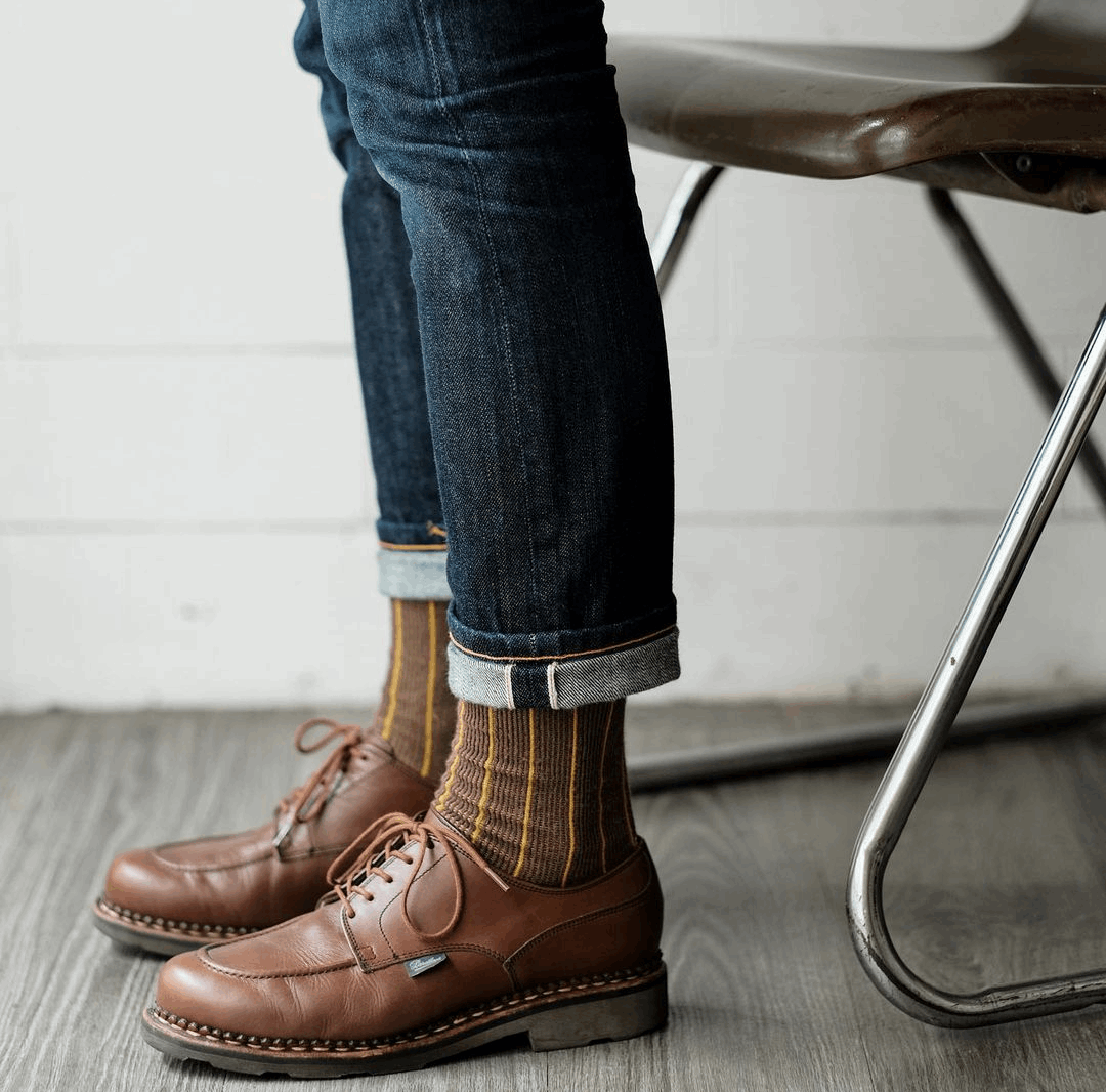 brown shoe with vertical stripe sock