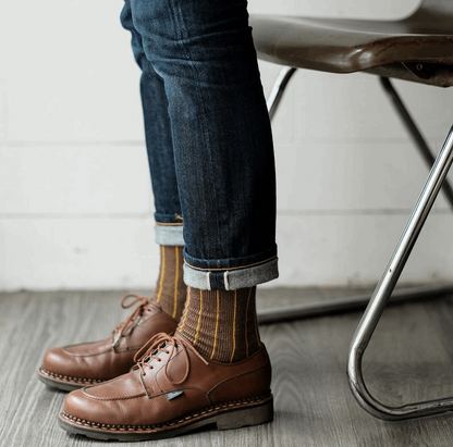 brown shoe with vertical stripe sock