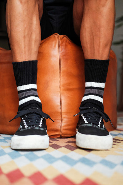 urban streetwear look with black striped socks and Vans