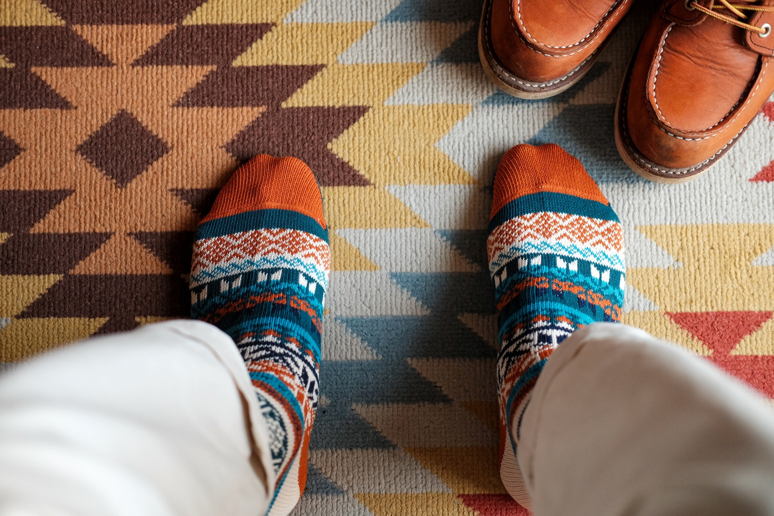 Boi blue and orange tribal pattern cotton crew socks flat lay – ComfySocks