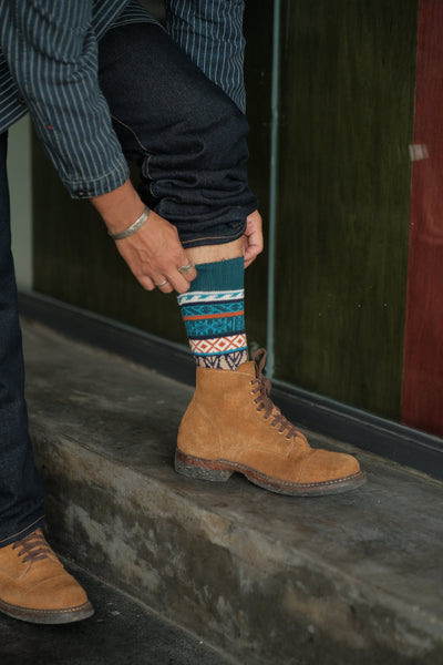 Boi blue and orange tribal cotton crew socks worn outdoors – ComfySocks