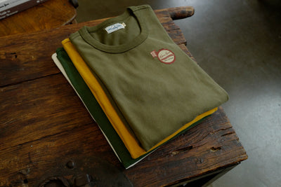 Close-up of Forest Green crewneck tee on model, vintage fit