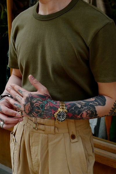 Close-up of Forest Green crewneck tee on model, vintage fit with pants