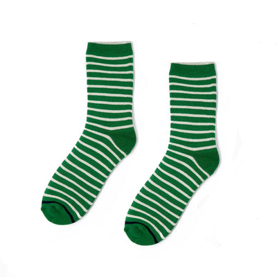 Japanese Thick Green Stripe Socks styled with sneakers on white background.