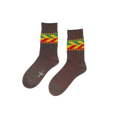 Kaze Brown cotton crew socks with red, yellow, and green tribal stripe design on white background
