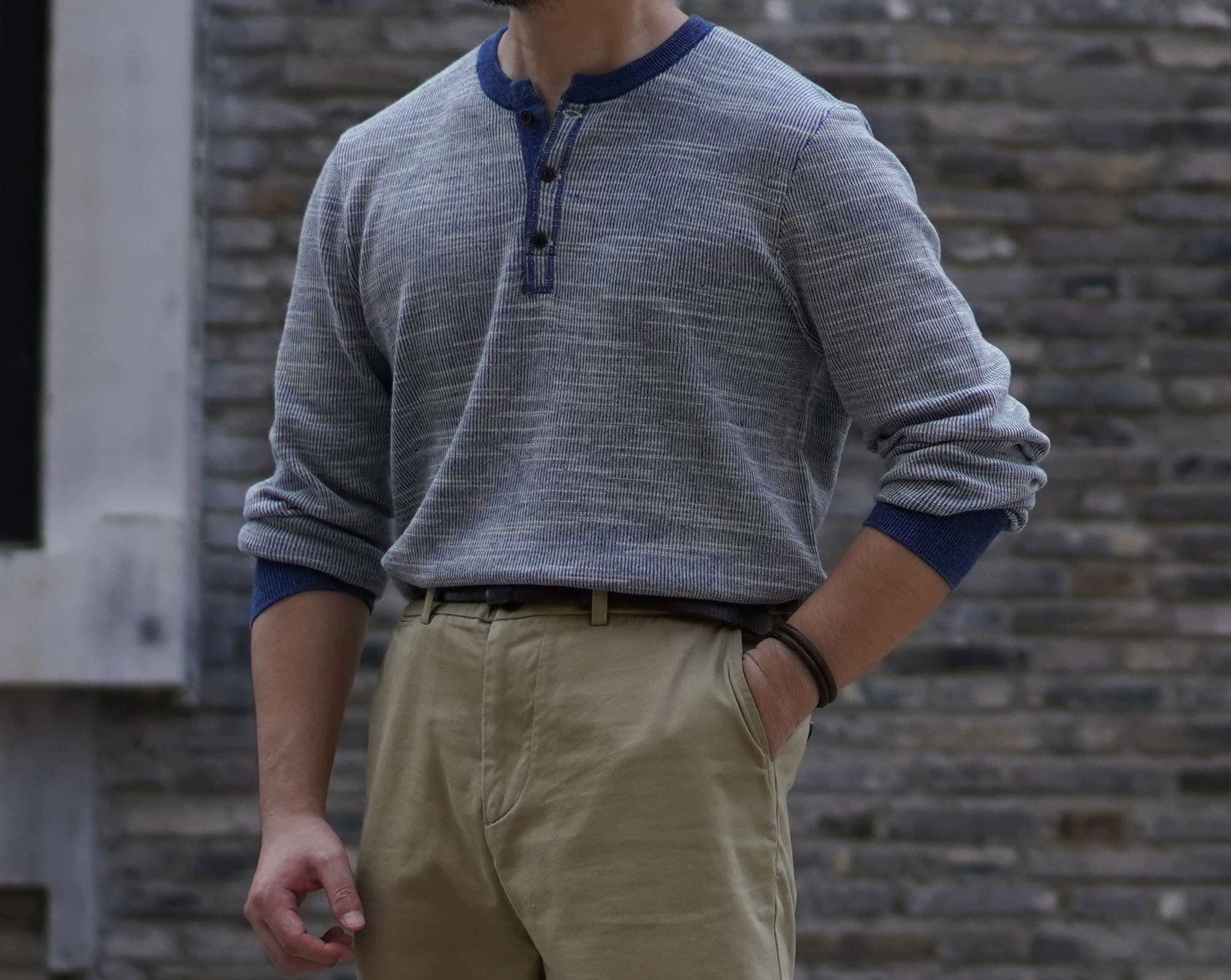 Vintage-style indigo henley long sleeve worn with chinos for casual everyday look