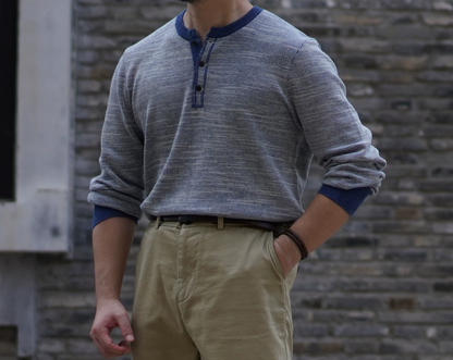 Vintage-style indigo henley long sleeve worn with chinos for casual everyday look