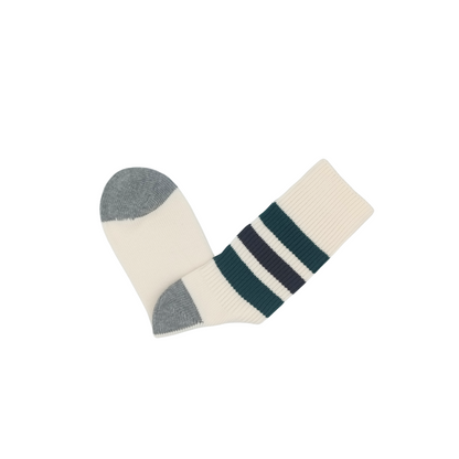 Retro Riki striped cotton crew socks folded flat with cream base and green/navy stripes.