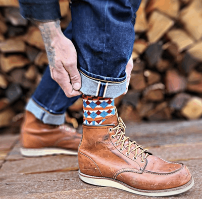 Tanami tribal crew socks worn with leather boots in urban outdoor setting – ComfySocks